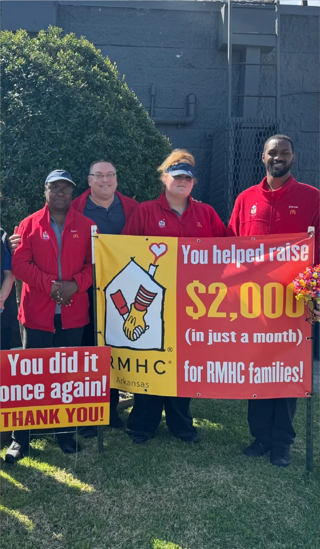 McDonalds team with signs of appreciation for fundraising efforts