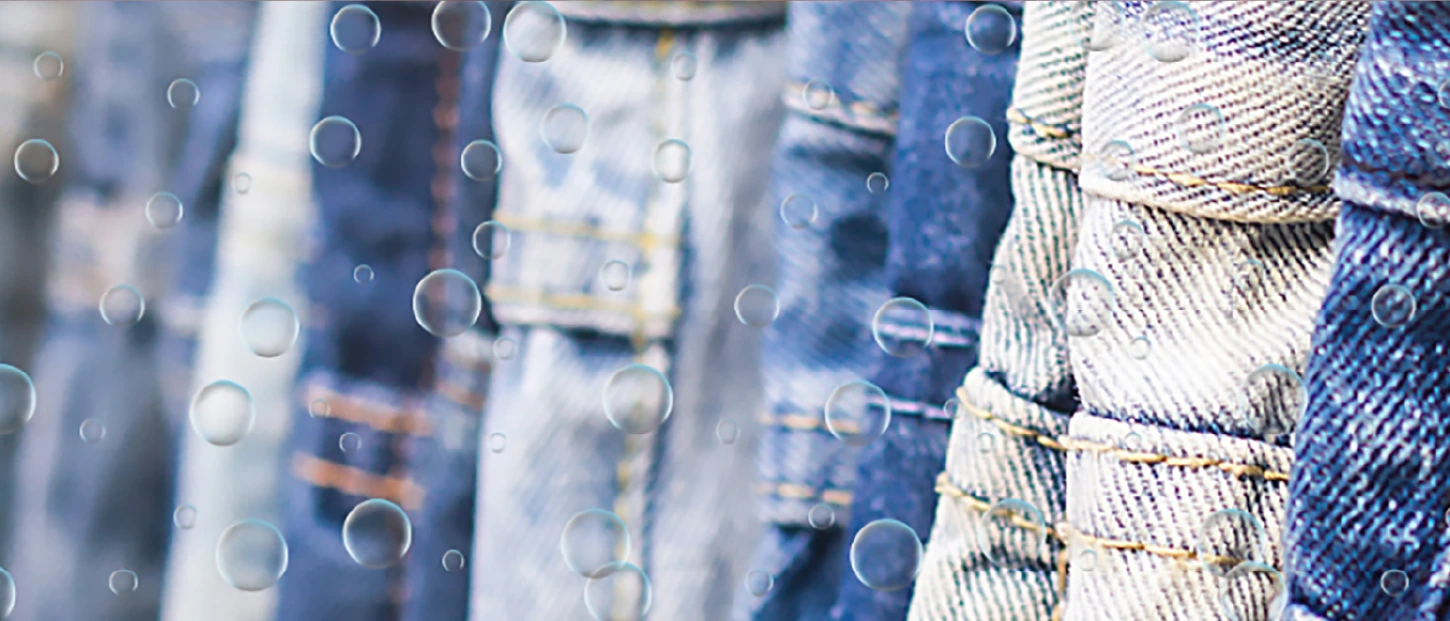 various shades of blue denim jeans with a layer of bubbles floating on top