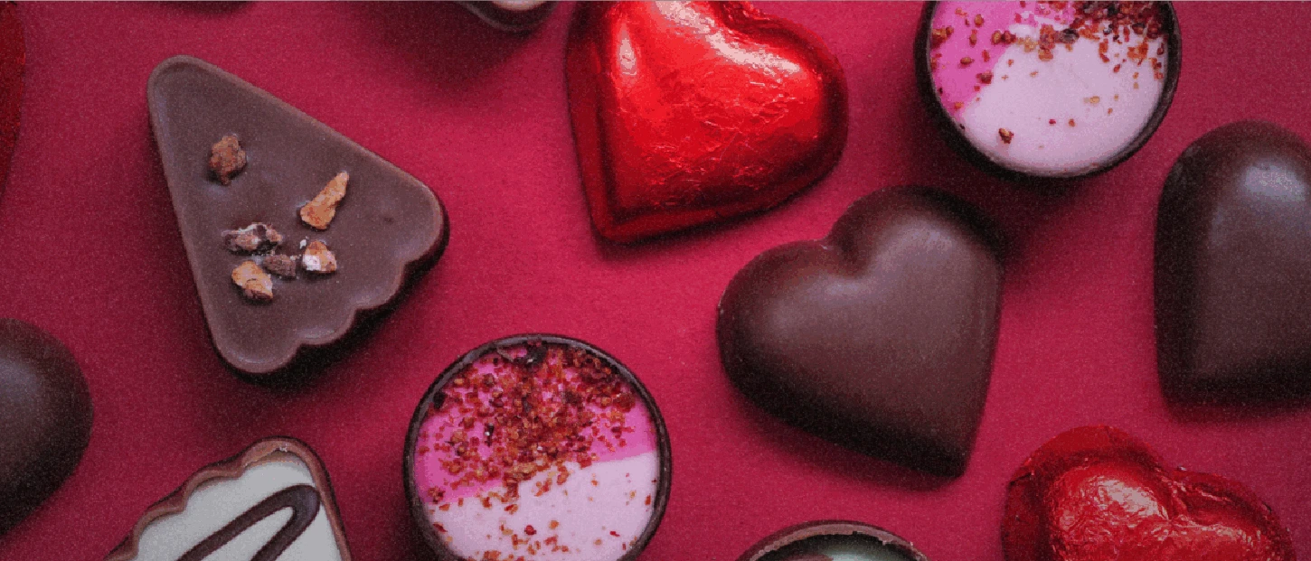 assorted chocolates over red background