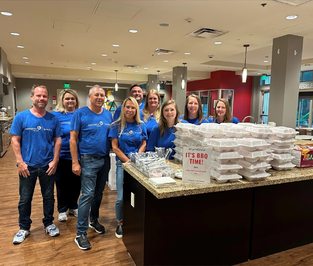 corporate group gather to serve a meal to our families
