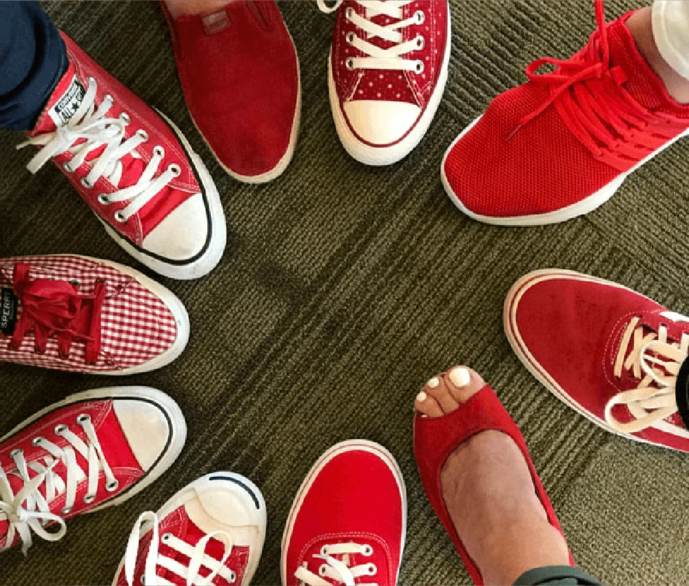 various styles of red shoes gathered in a circle