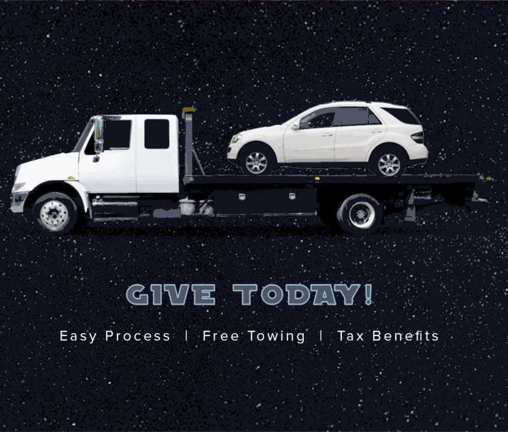 suv on the back of a tow truck being donated to charity